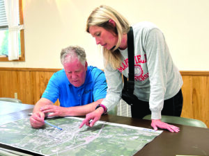 The EADS Group reviews map with Mansfield resident.